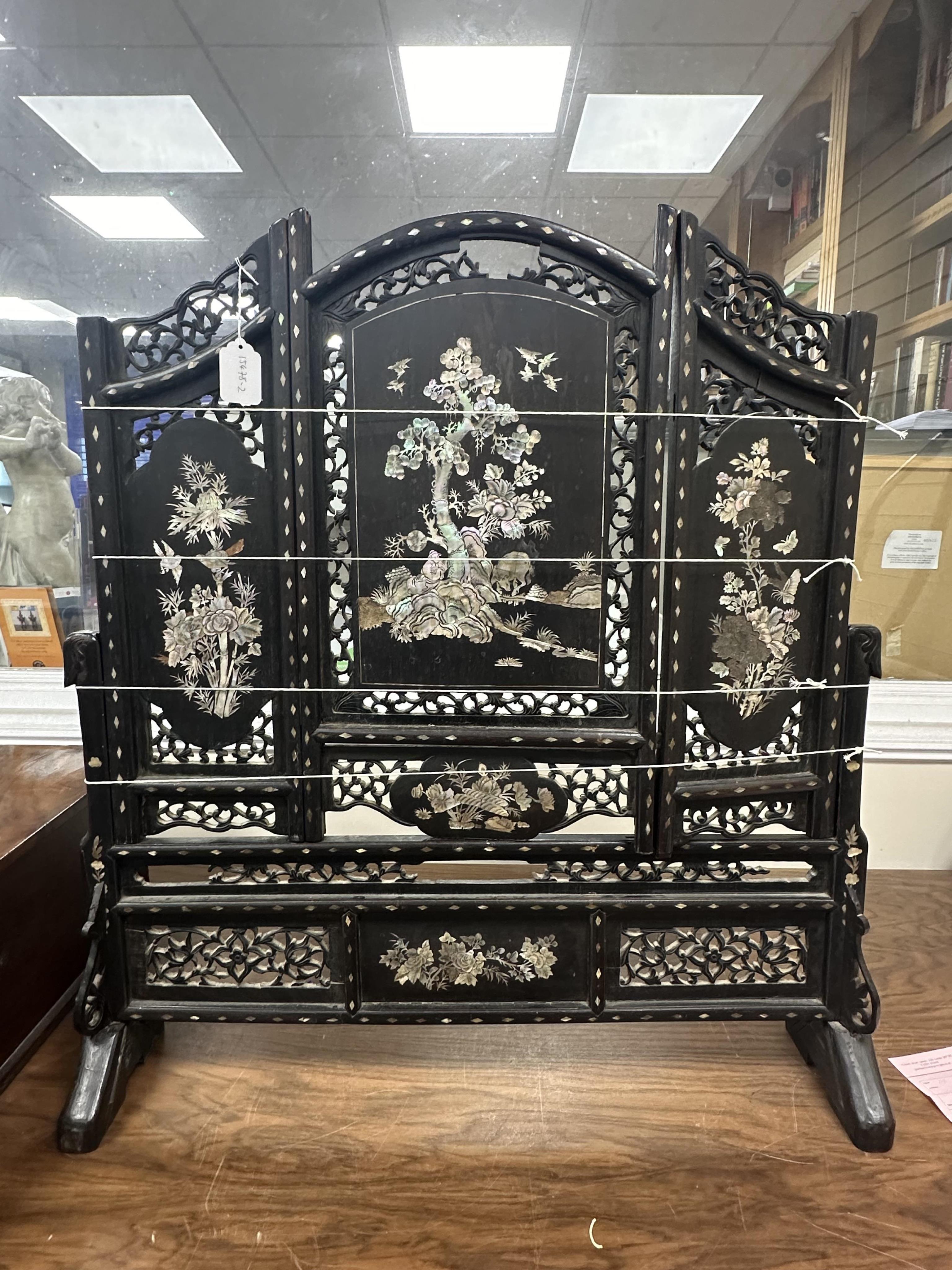 A Chinese mother of pearl inlaid hardwood table screen, width 78cm, height 86cm. Condition - poor to fair